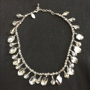 Beautiful gray glass like necklace .